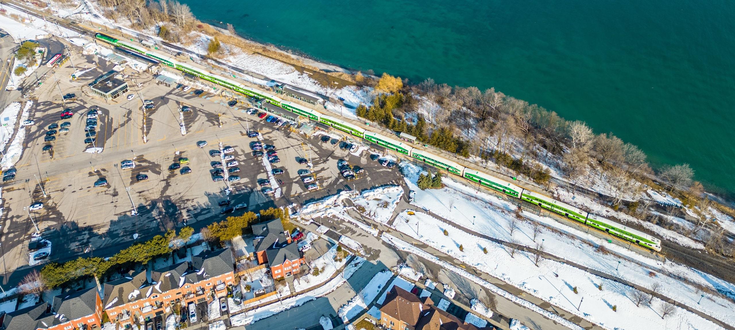 Aerial view of GO station and multi-family homes around it in Scarborough, ON